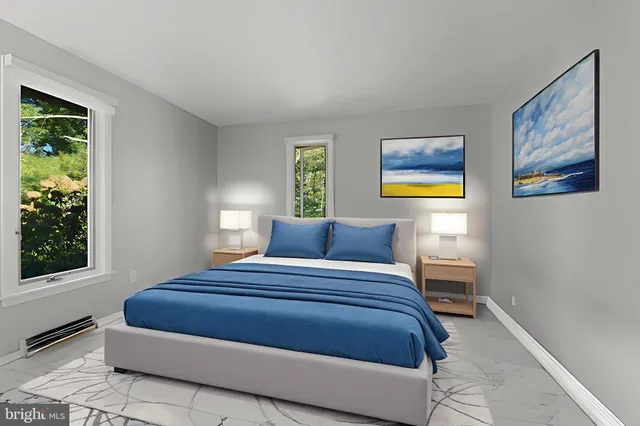 an aerial view of residential house with outdoor space and trees all around