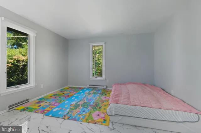 an aerial view of residential house with outdoor space and trees all around