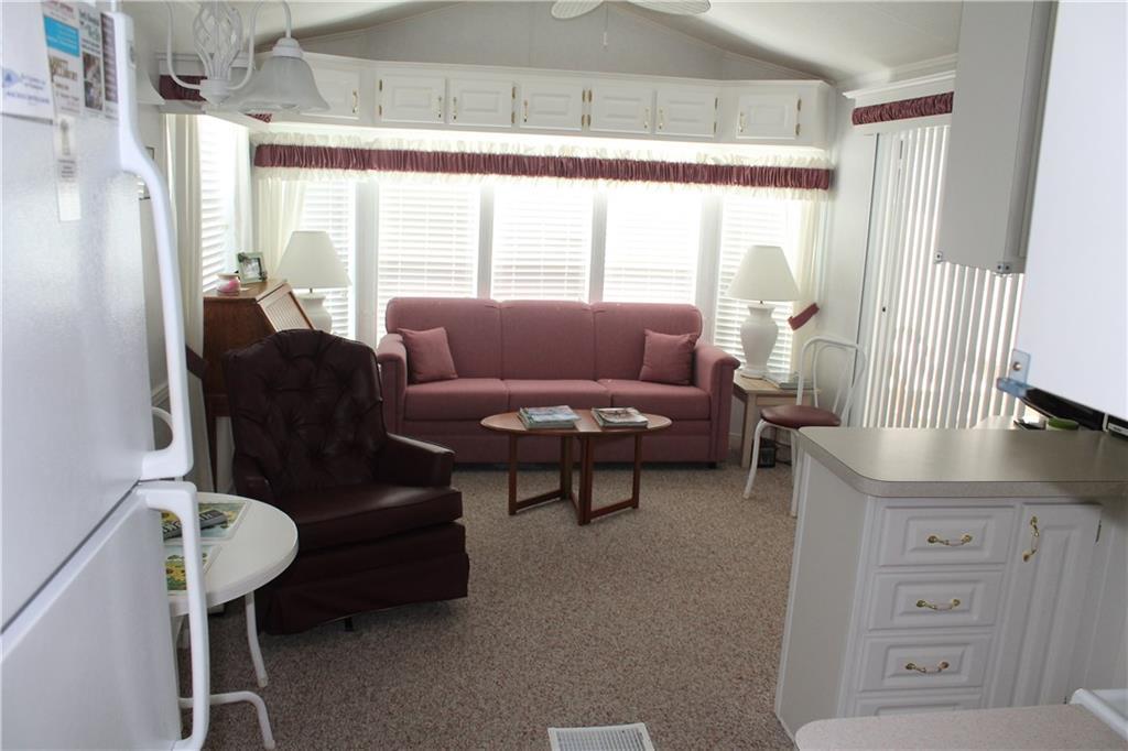54 Bypass Road, Unit 8 Wells, ME 04090 - Photo 7 of 24 Living area with entrance to the...