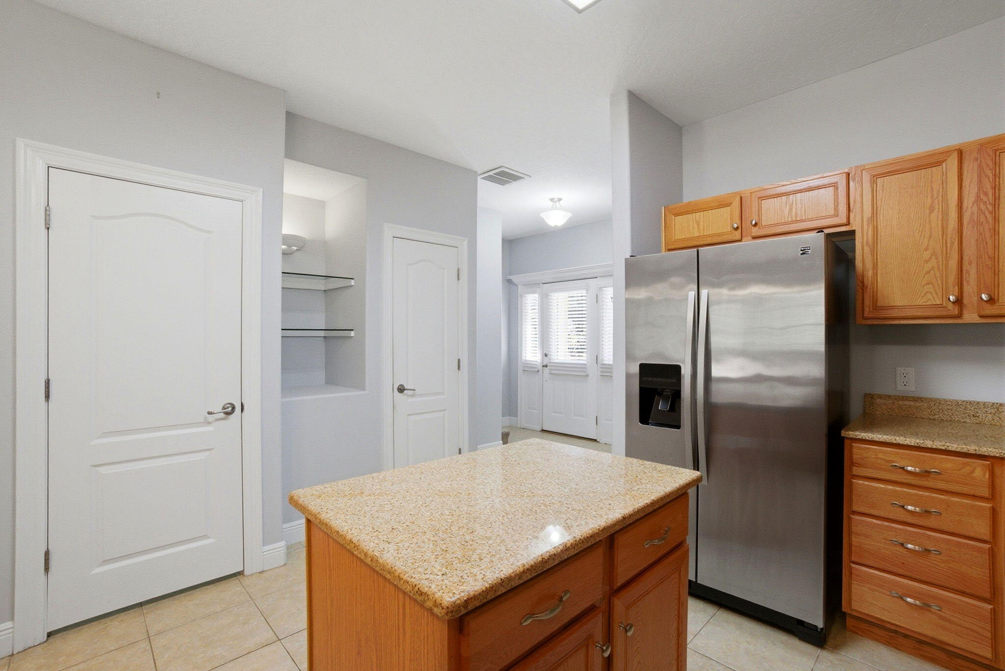 8562 Laredo Street Navarre, FL 32566 - Photo 11 of 43 a kitchen with stainless steel appliances granite countertop a refrigerator and a stove
