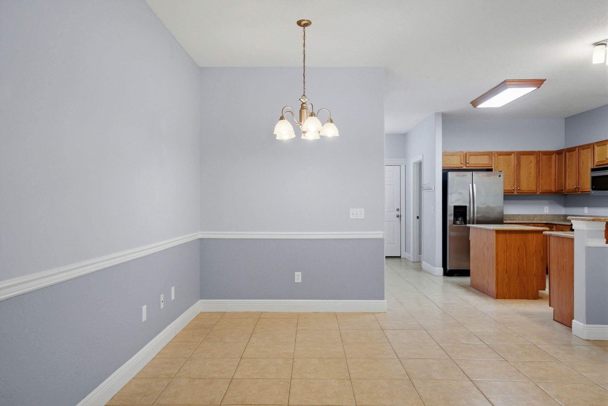 8562 Laredo Street Navarre, FL 32566 - Photo 13 of 43 a view of a kitchen with a sink and dishwasher