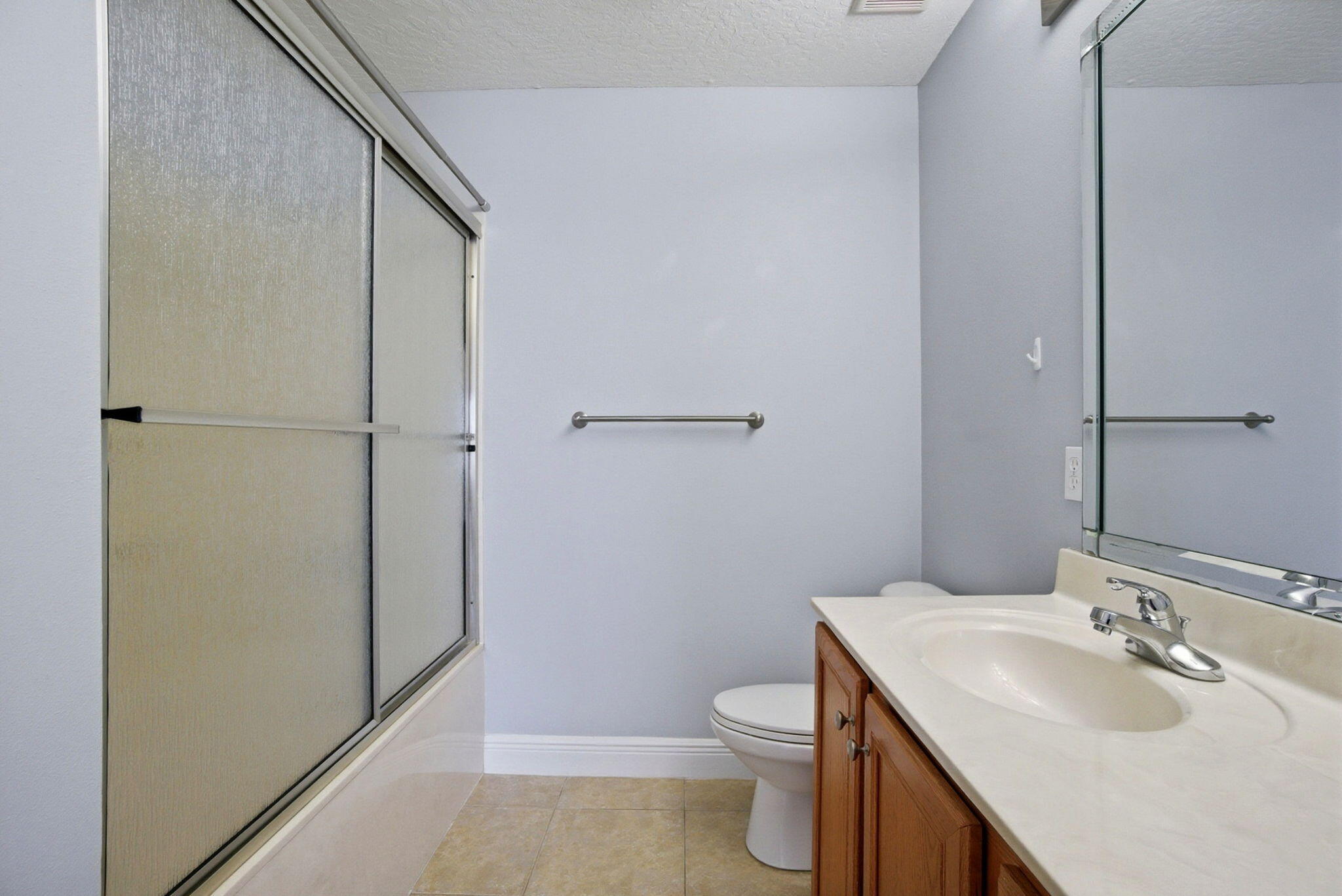 8562 Laredo Street Navarre, FL 32566 - Photo 25 of 43 a bathroom with a sink toilet and shower