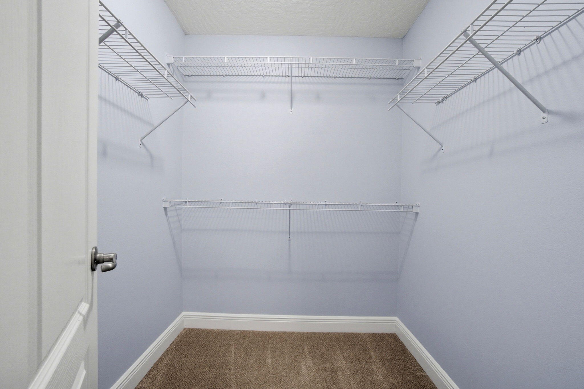 8562 Laredo Street Navarre, FL 32566 - Photo 30 of 43 a view of a room with racks on the wall