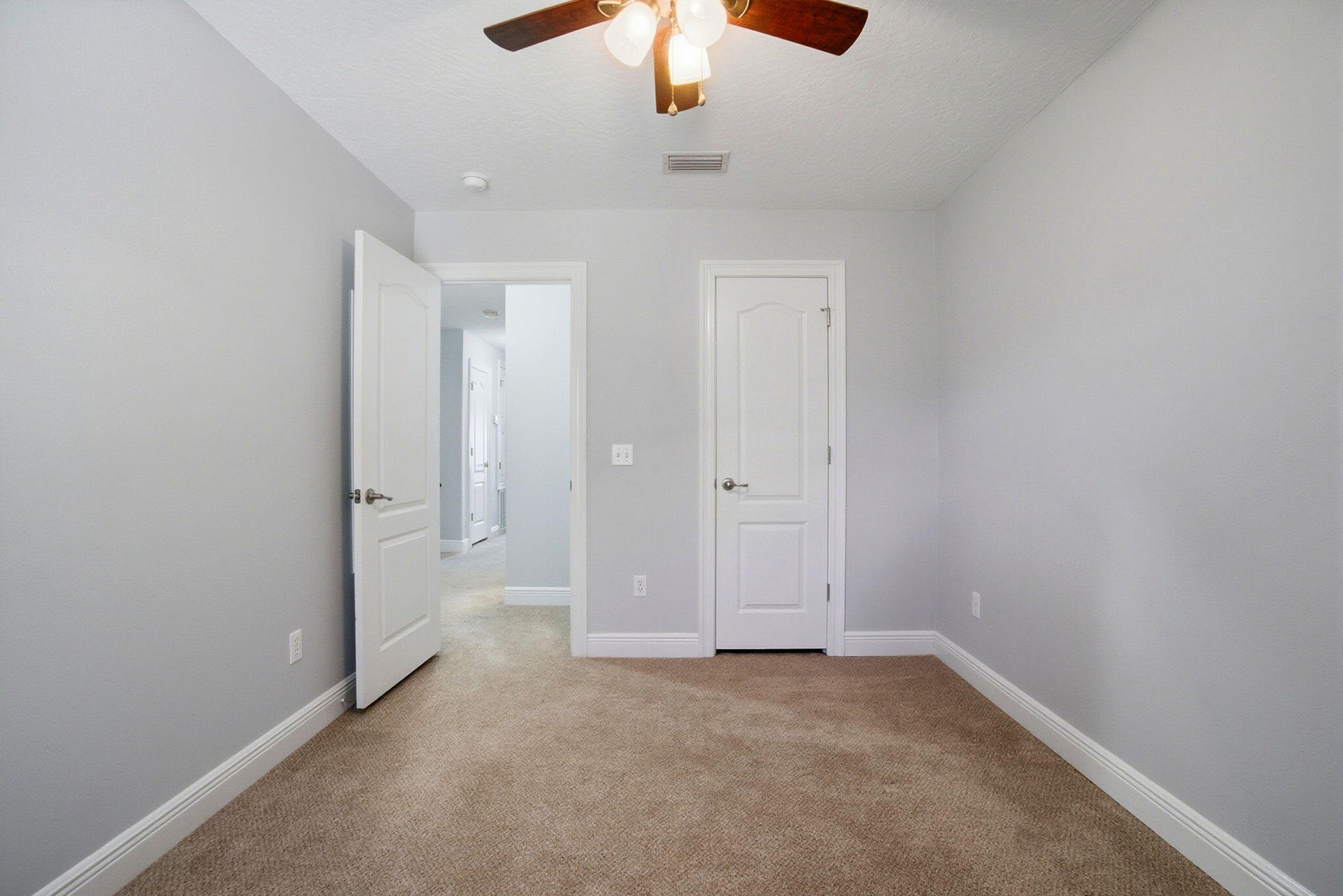 8562 Laredo Street Navarre, FL 32566 - Photo 32 of 43 an empty room with a chandelier fan