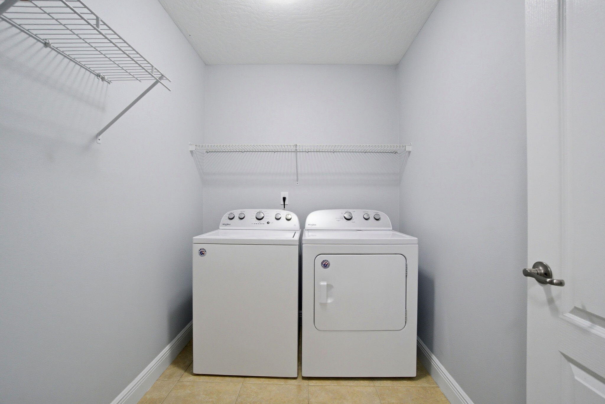 8562 Laredo Street Navarre, FL 32566 - Photo 33 of 43 a utility room with dryer and washer
