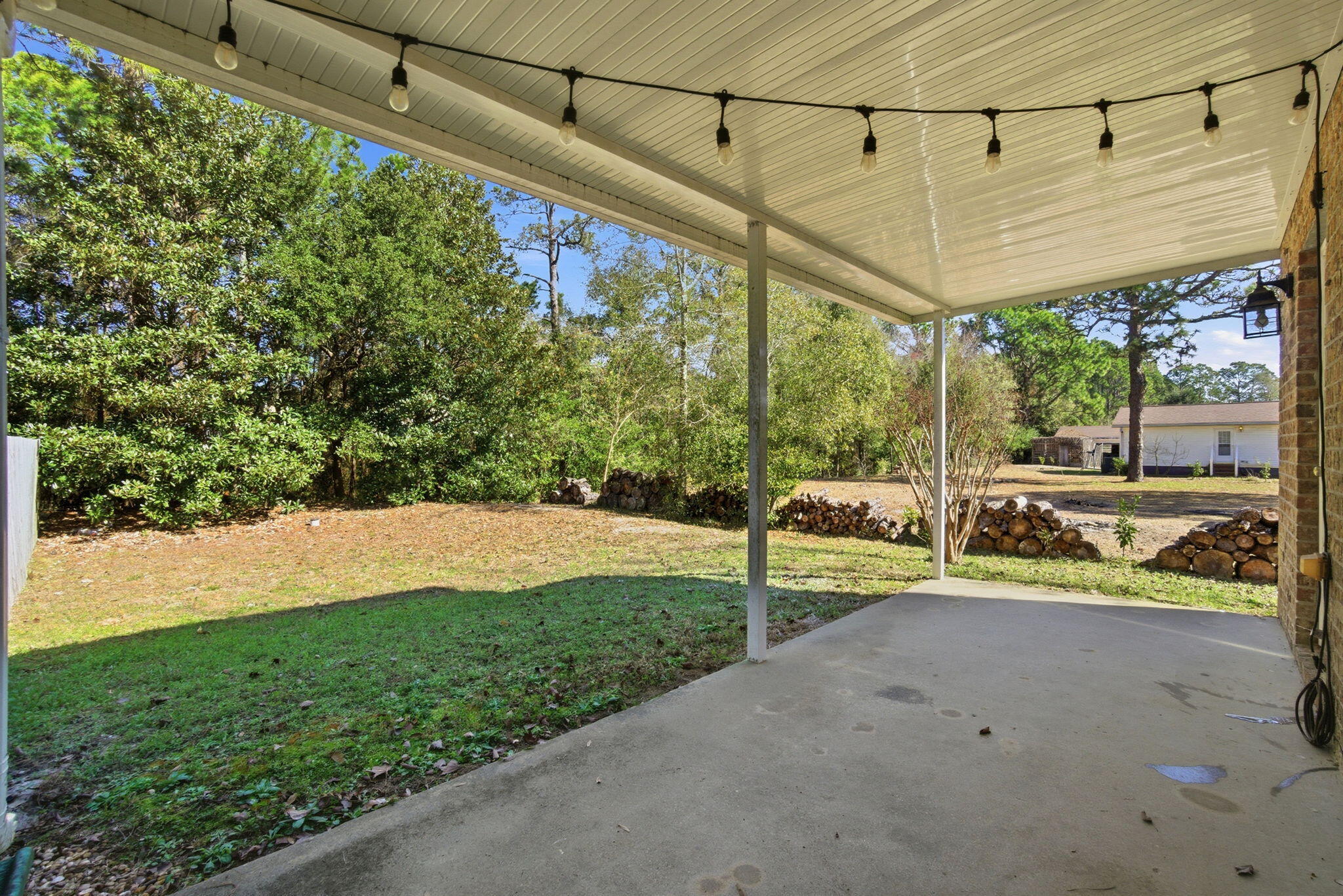 8562 Laredo Street Navarre, FL 32566 - Photo 37 of 43 a view of a couches in front of a house