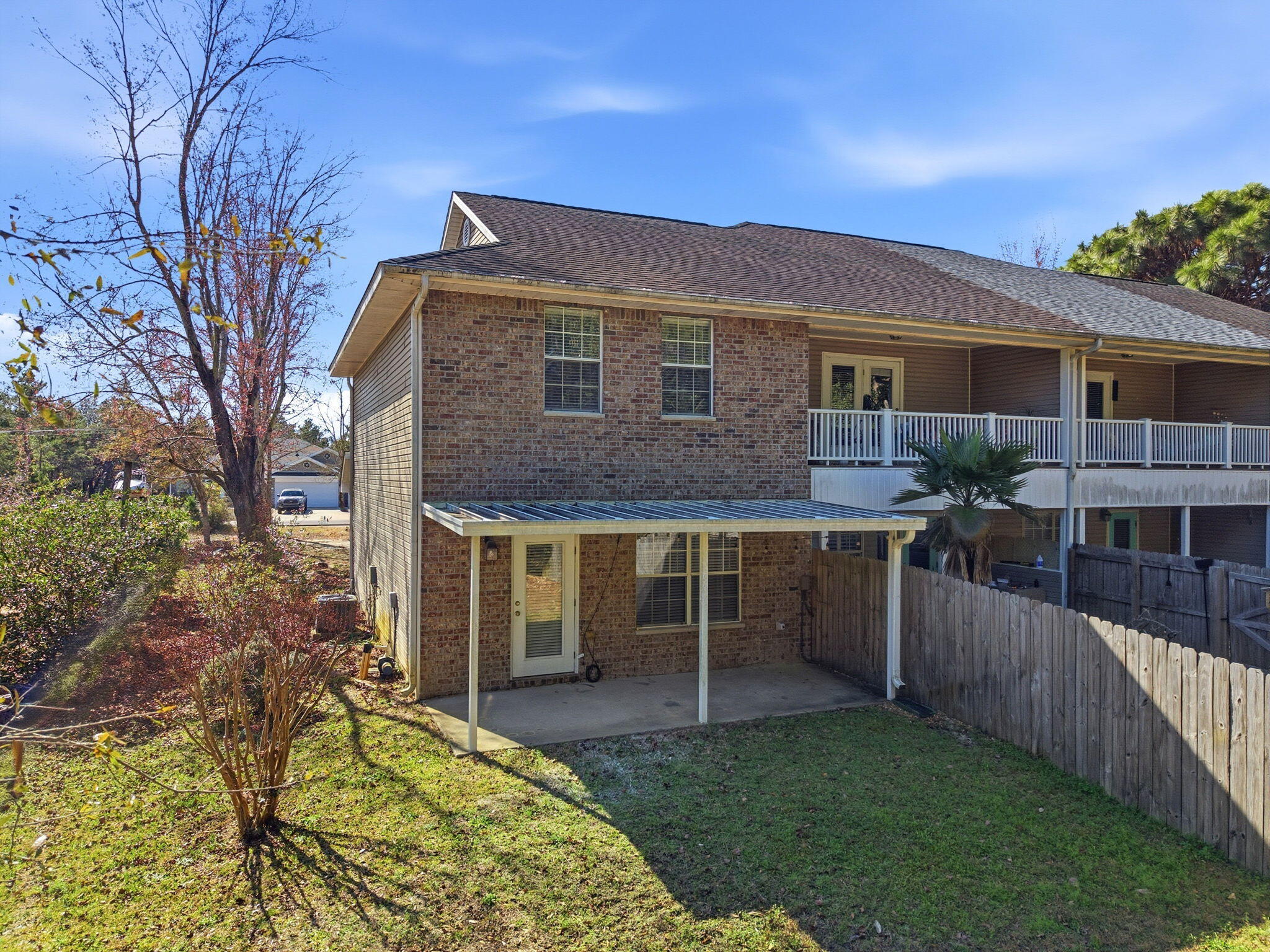 8562 Laredo Street Navarre, FL 32566 - Photo 39 of 43 a view of house with a yard and furniture