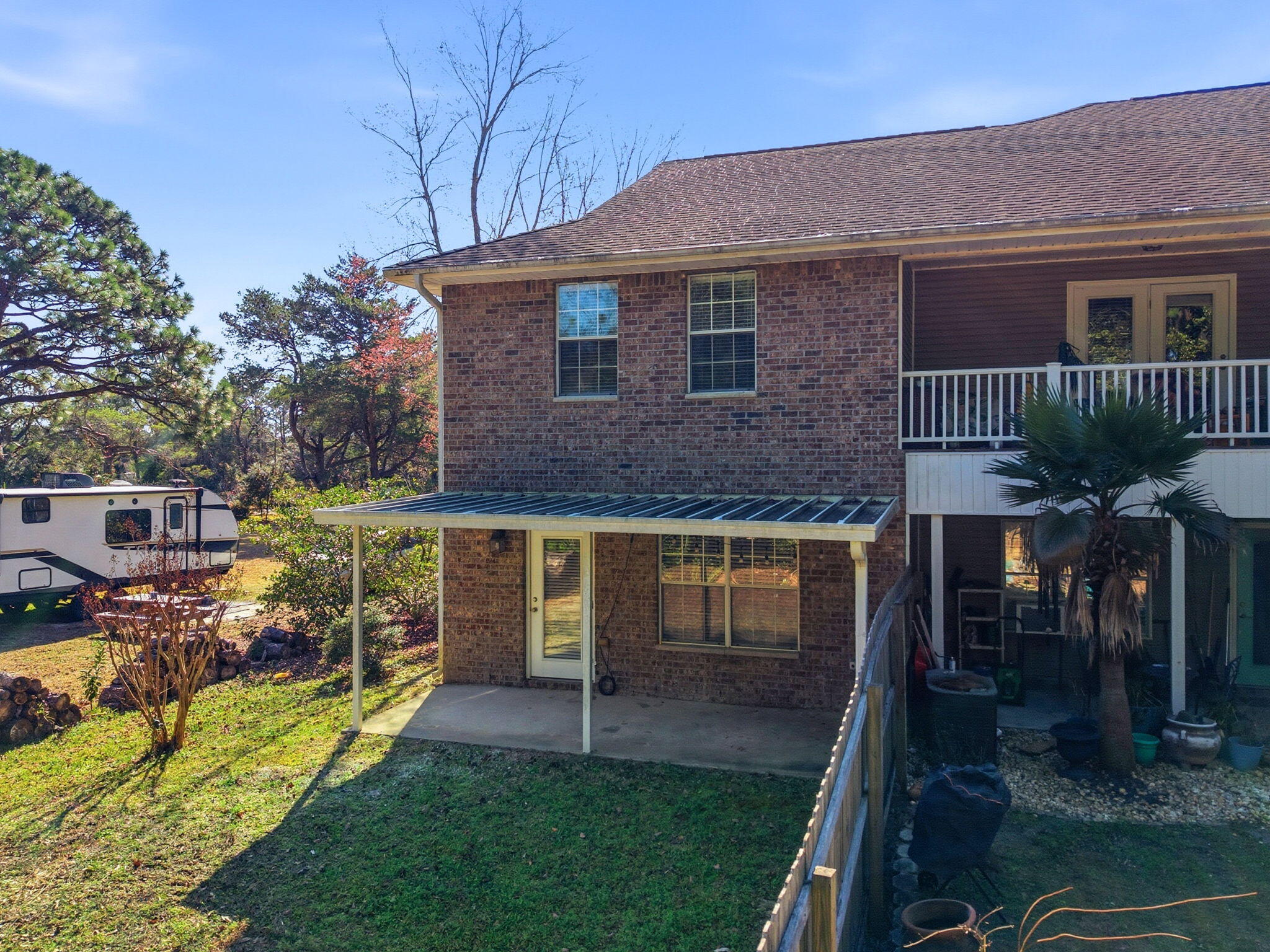 8562 Laredo Street Navarre, FL 32566 - Photo 41 of 43 a front view of a house with garden