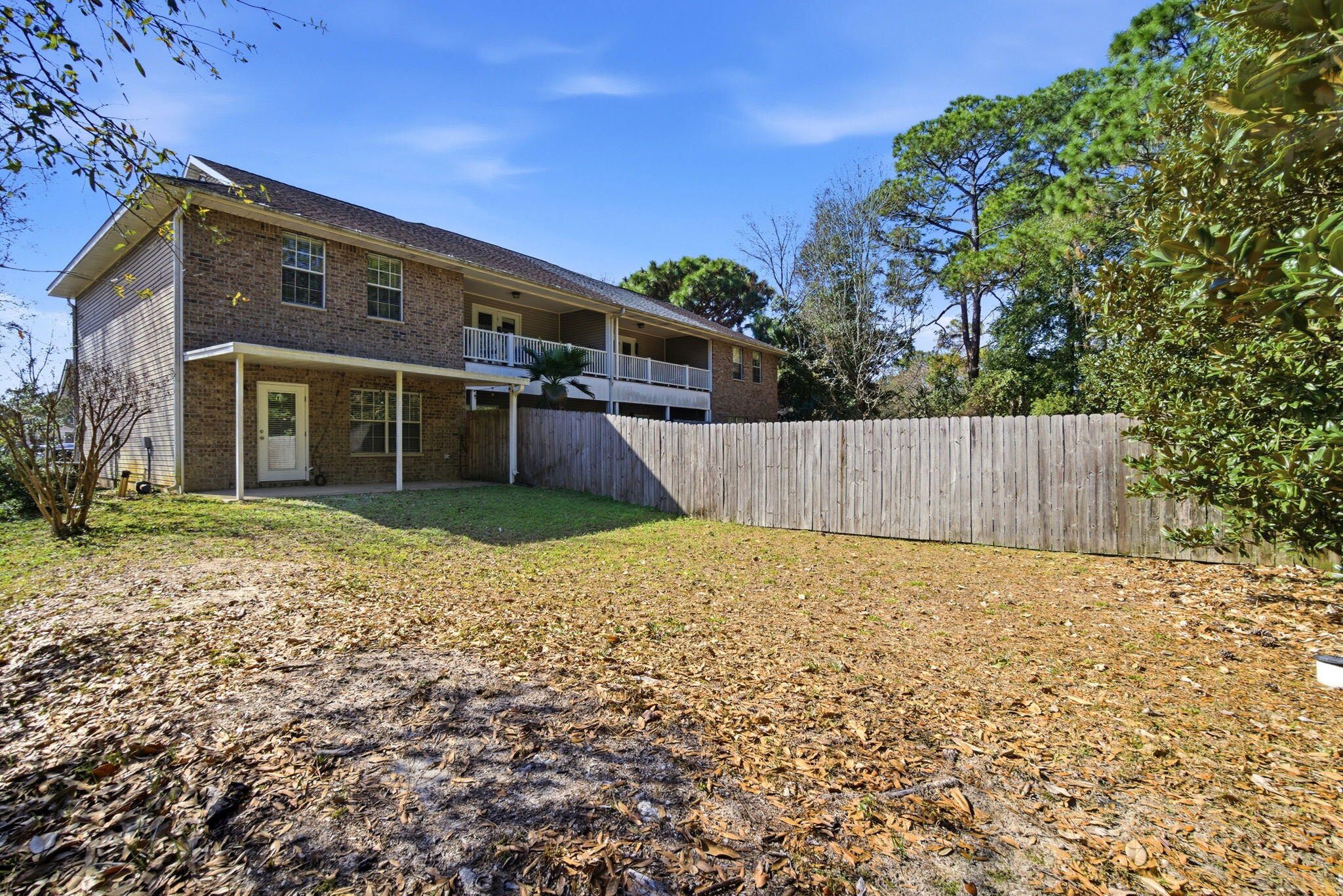 8562 Laredo Street Navarre, FL 32566 - Photo 42 of 43 a front view of a house with a yard