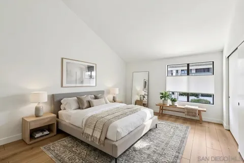a bedroom with a bed and a couch