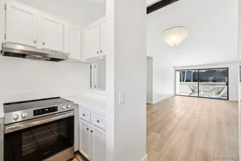 a kitchen with stainless steel appliances granite countertop a stove and a refrigerator