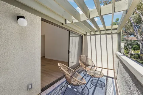 a view of a room with table and chairs