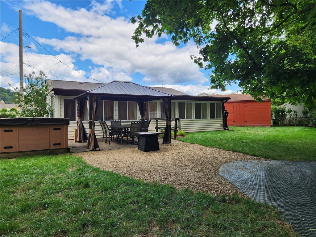 9 South Spring Street Pittsburgh, PA 15223 - Photo 18 of 22 a view of a house with backyard sitting area and garden