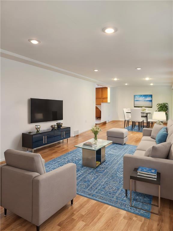 9 South Spring Street Pittsburgh, PA 15223 - Photo 6 of 22 a living room with furniture and a flat screen tv