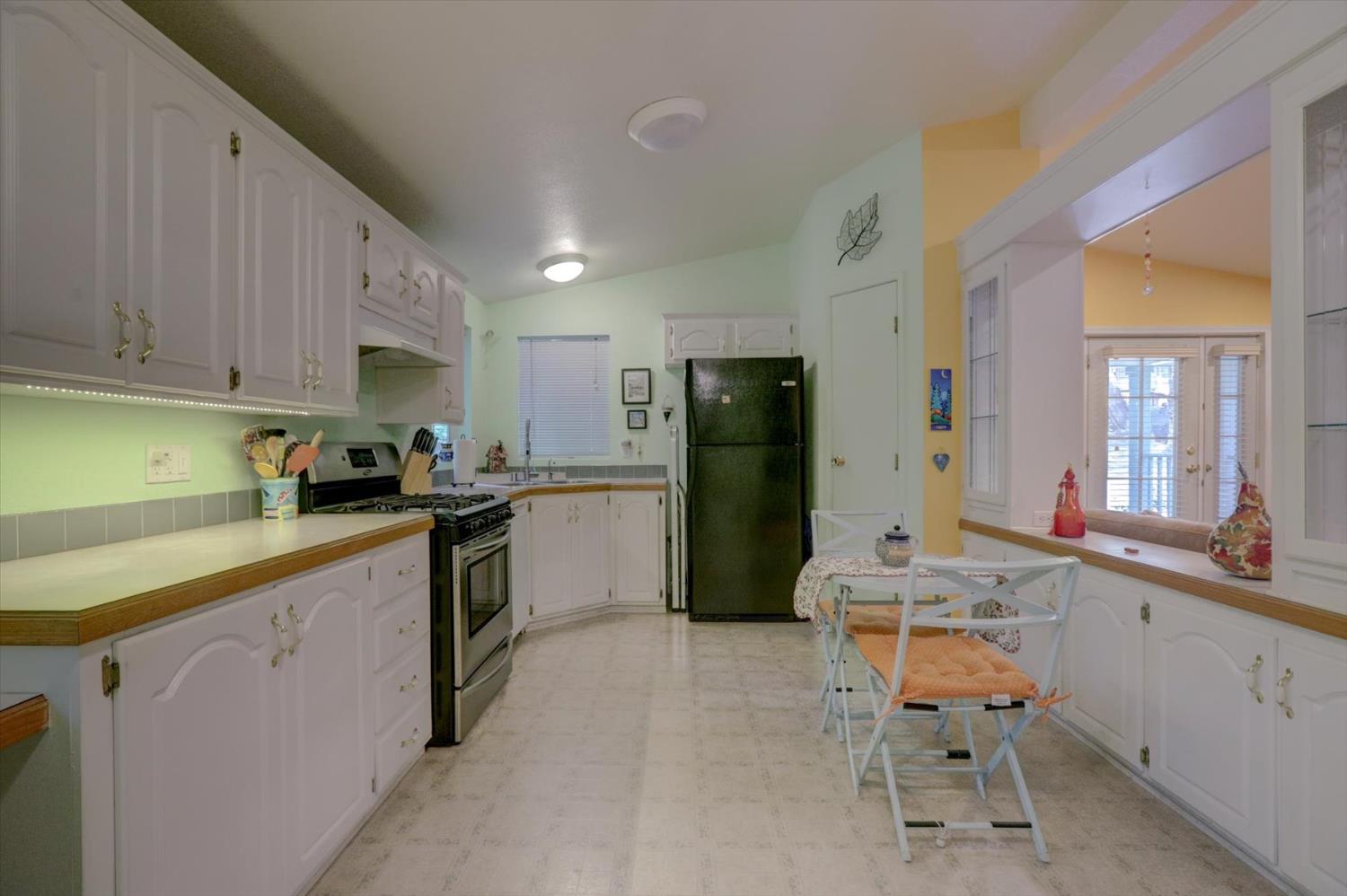 251 Willow Valley Road, Unit 17 Nevada City, CA 95959 - Photo 12 of 58 a kitchen with a sink appliances and cabinets
