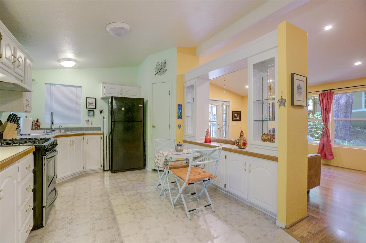 251 Willow Valley Road, Unit 17 Nevada City, CA 95959 - Photo 14 of 58 a kitchen with a refrigerator and a sink