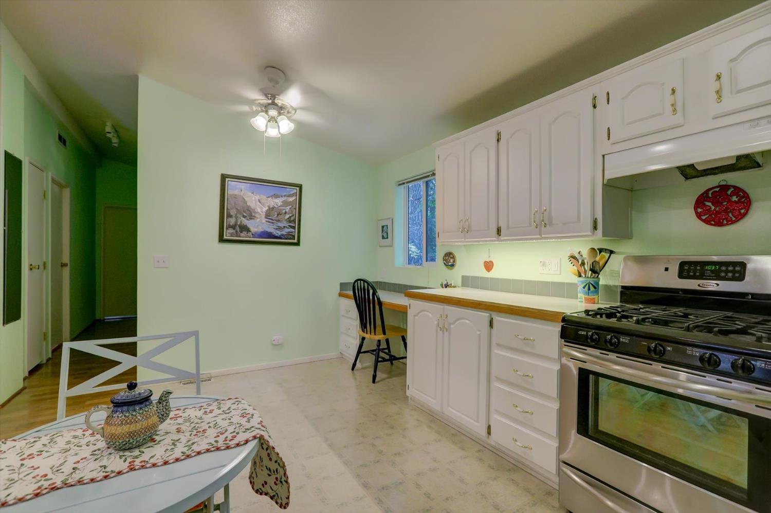 251 Willow Valley Road, Unit 17 Nevada City, CA 95959 - Photo 15 of 58 a kitchen with a stove and cabinets