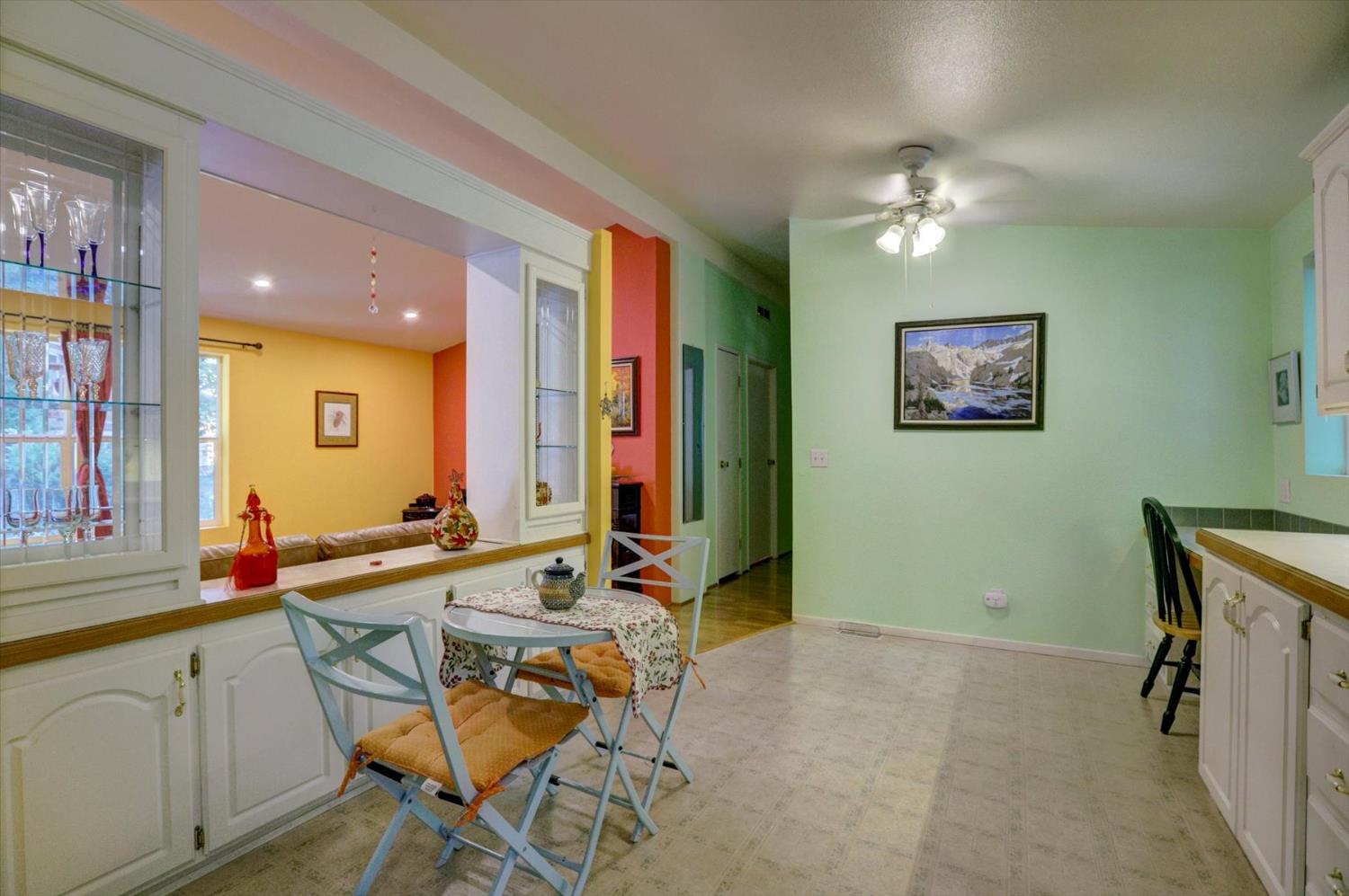251 Willow Valley Road, Unit 17 Nevada City, CA 95959 - Photo 16 of 58 a view of a dining room with furniture and a chandelier