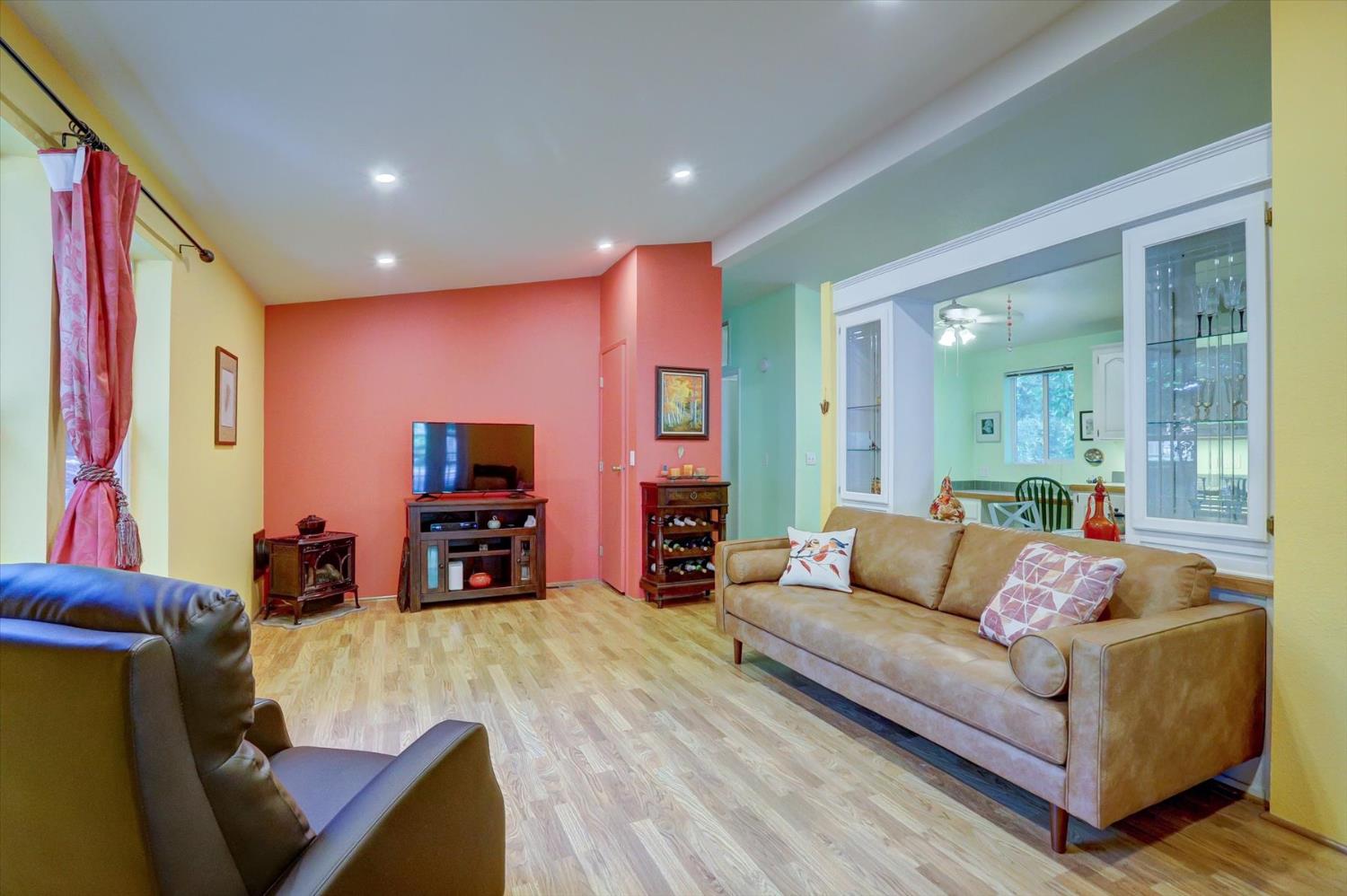 251 Willow Valley Road, Unit 17 Nevada City, CA 95959 - Photo 3 of 58 a living room with furniture and a flat screen tv