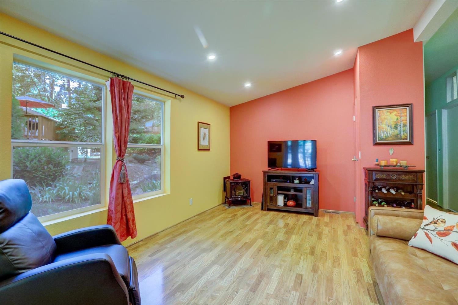 251 Willow Valley Road, Unit 17 Nevada City, CA 95959 - Photo 7 of 58 a living room with furniture and a flat screen tv