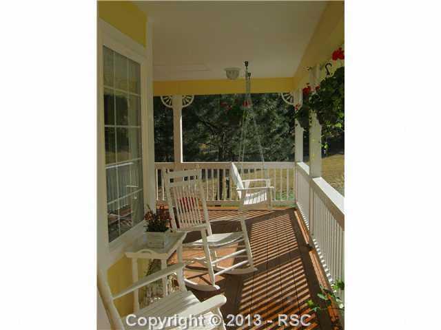 17425 Lodgepole Road Peyton, CO 80831 - Photo 19 of 20 Beautiful decking overlooking meadow and mature Ponderosa Pines