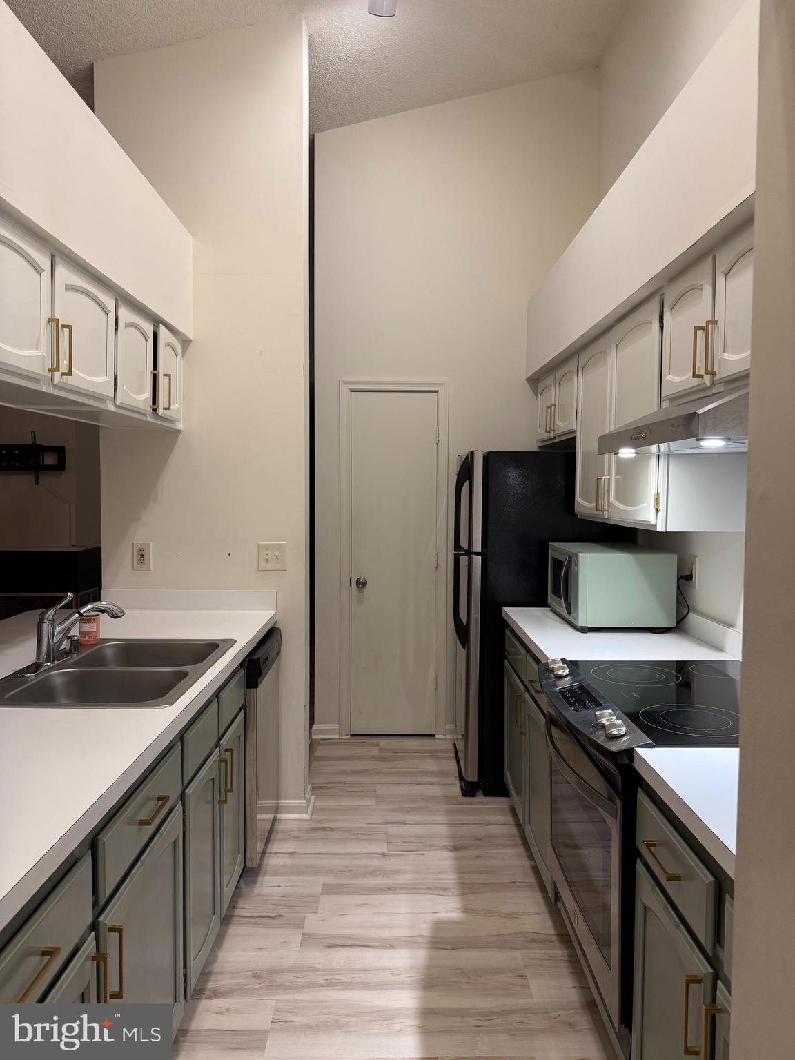 2601 Camelback Lane, Unit 12 Silver Spring, MD 20906 - Photo 3 of 14 a kitchen with a sink and a refrigerator