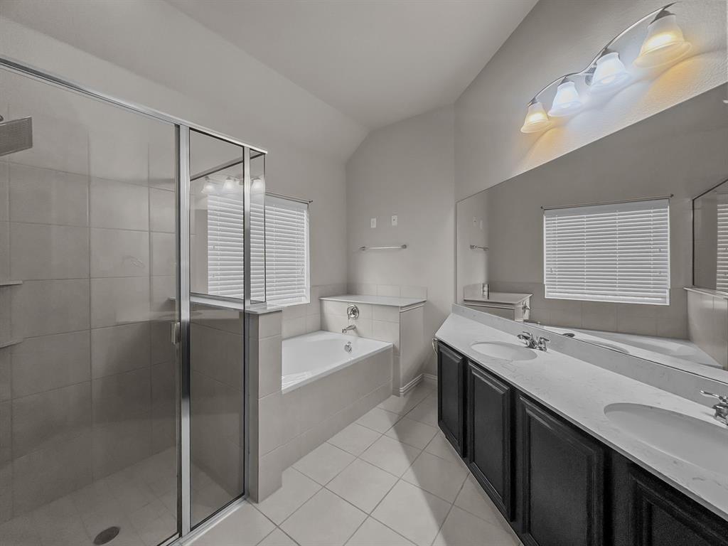 3205 Ridgeway Drive McKinney, TX 75071 - Photo 24 of 27 a spacious bathroom with a tub sink shower and mirror