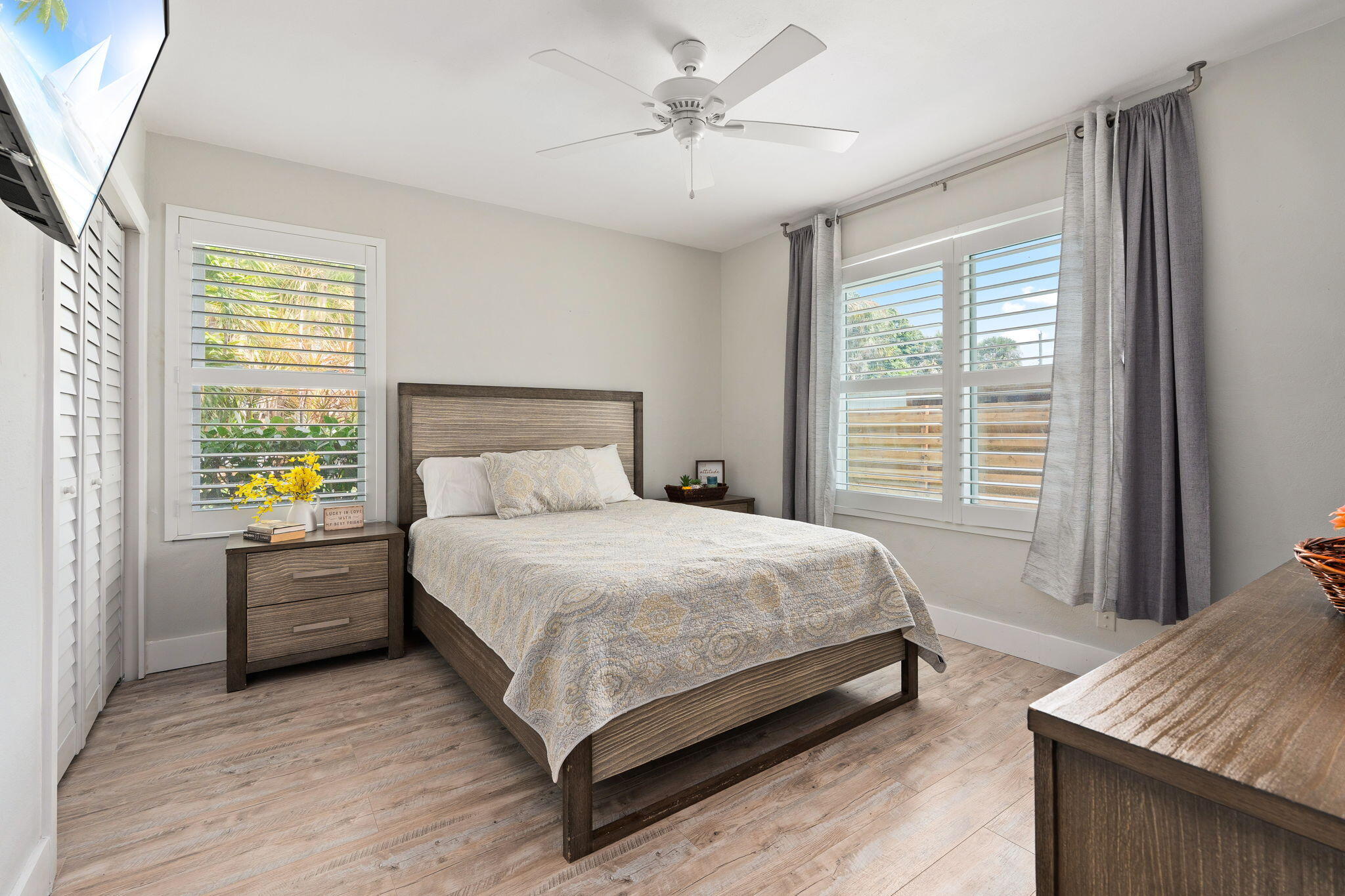 819 Southeast Stypmann Boulevard Stuart, FL 34994 - Photo 14 of 31 a bed sitting in a bedroom next to a window