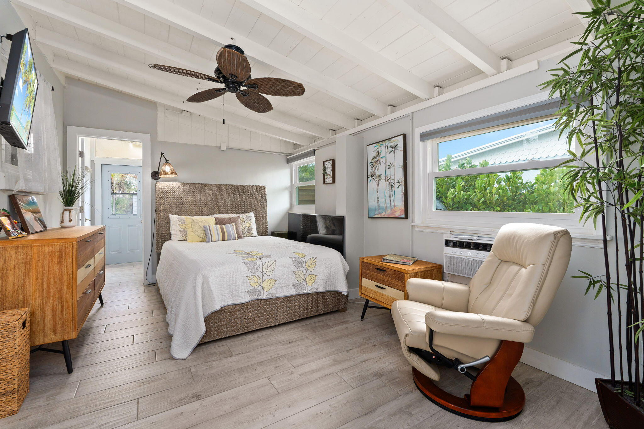 819 Southeast Stypmann Boulevard Stuart, FL 34994 - Photo 15 of 31 a bed room with a bed and a chair