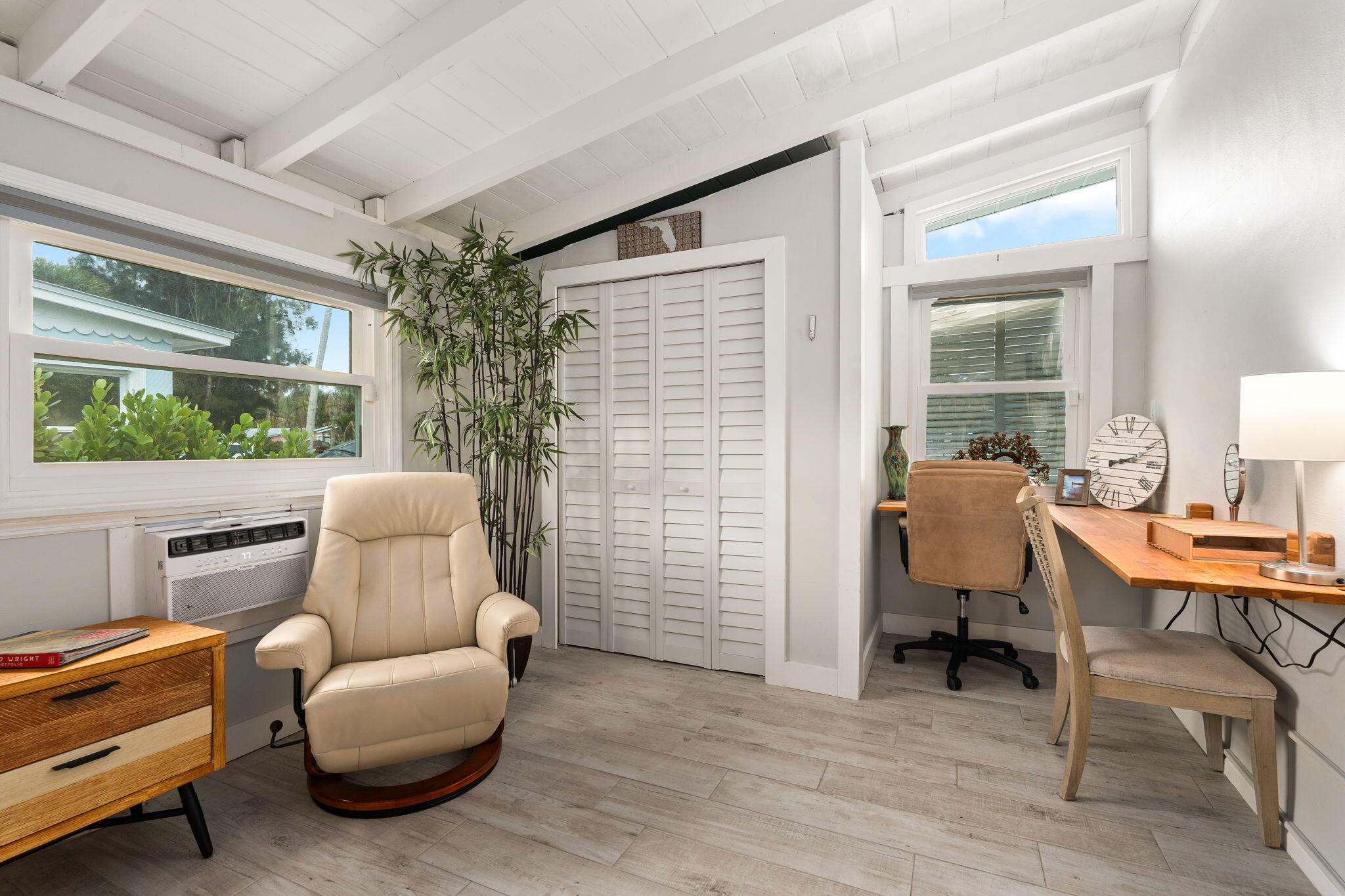 819 Southeast Stypmann Boulevard Stuart, FL 34994 - Photo 16 of 31 a living room with furniture and a window