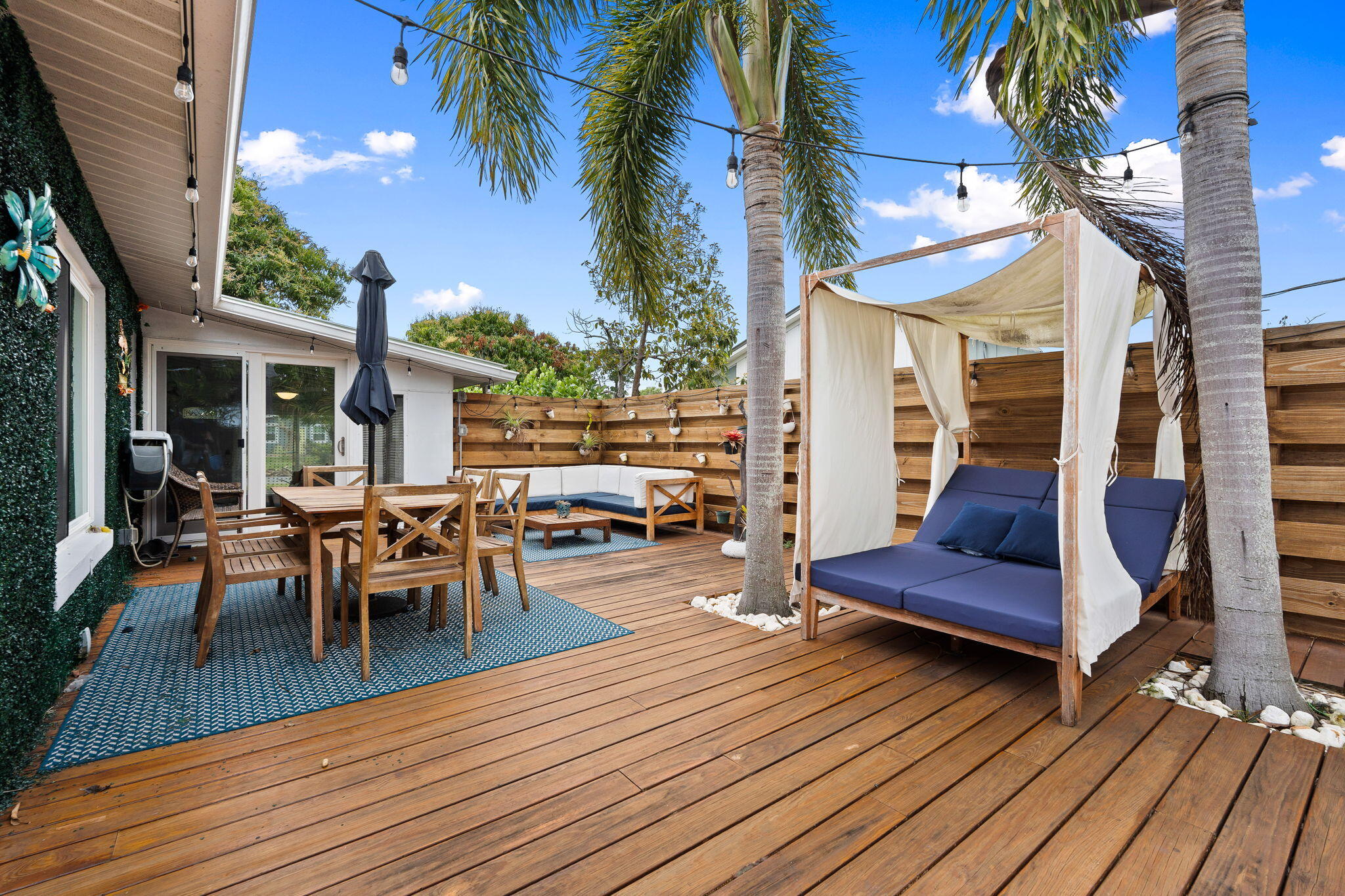 819 Southeast Stypmann Boulevard Stuart, FL 34994 - Photo 20 of 31 a view of a dinning table and chairs in the balcony
