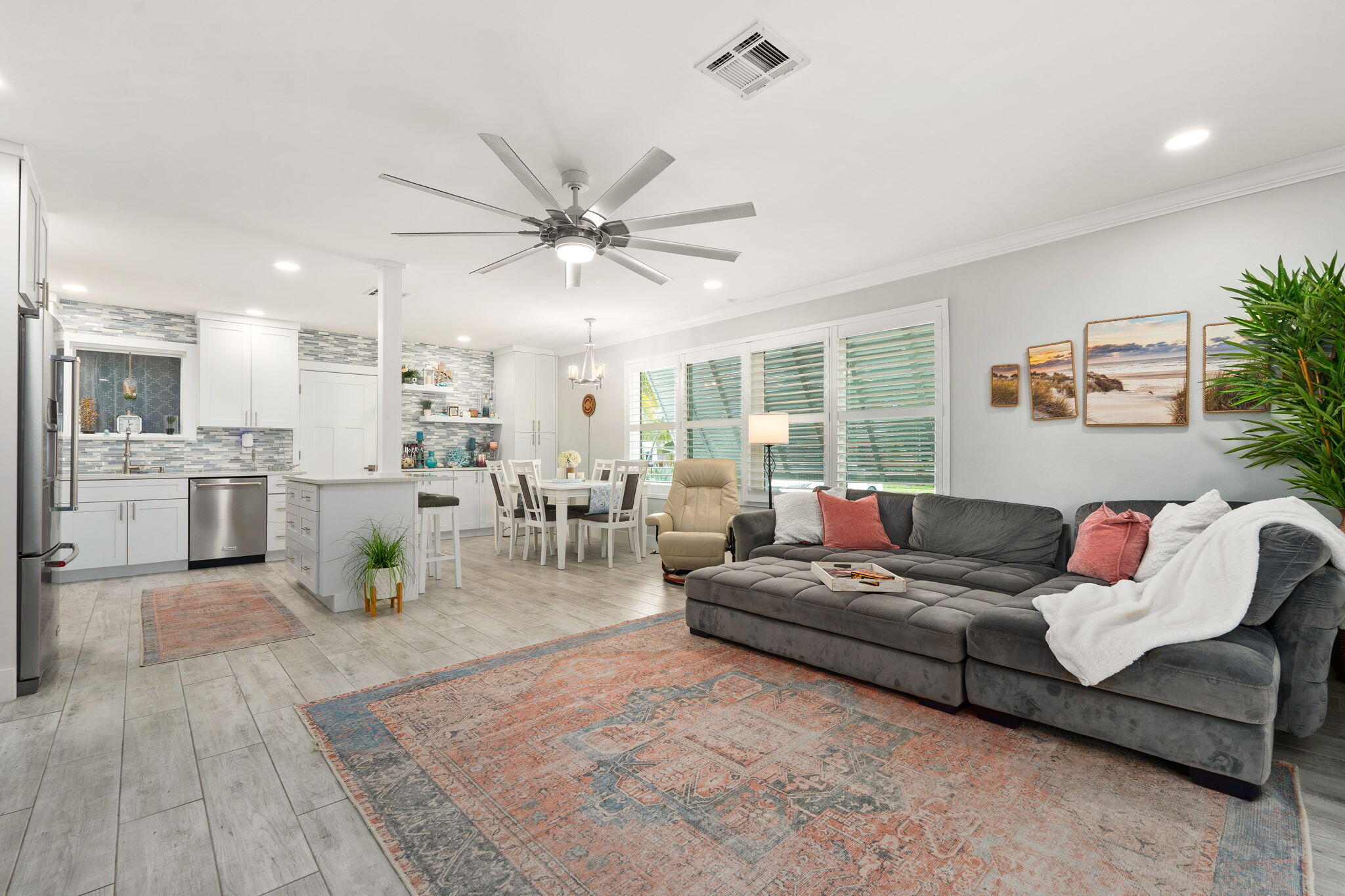 819 Southeast Stypmann Boulevard Stuart, FL 34994 - Photo 6 of 31 a living room with furniture and a large window