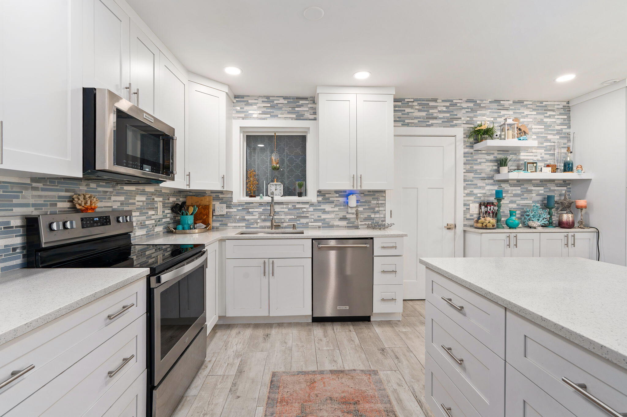 819 Southeast Stypmann Boulevard Stuart, FL 34994 - Photo 7 of 31 a kitchen with a sink stove and cabinets