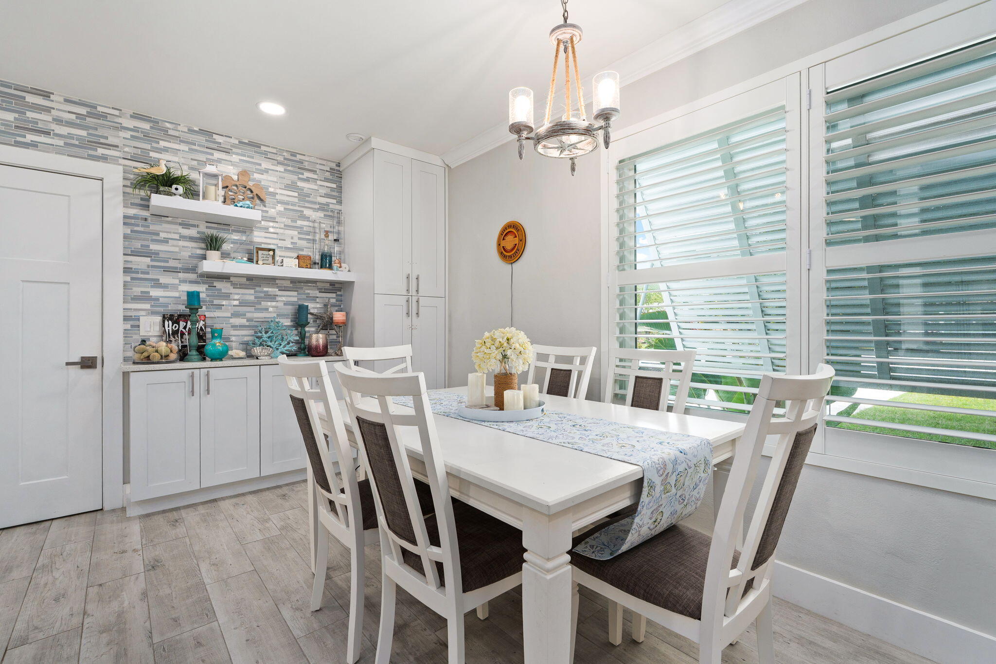 819 Southeast Stypmann Boulevard Stuart, FL 34994 - Photo 8 of 31 a view of a dining room with furniture window and outside view