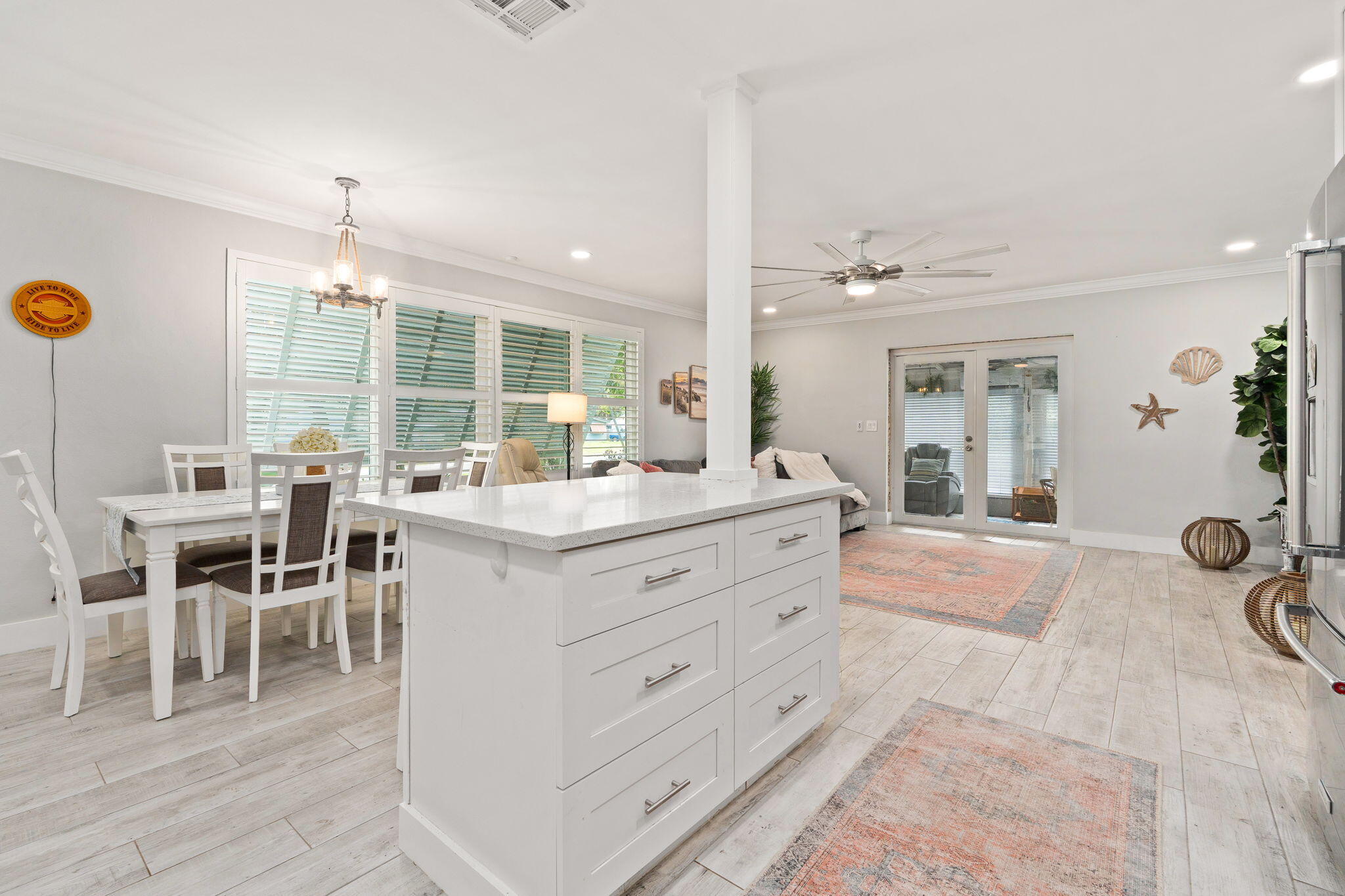 819 Southeast Stypmann Boulevard Stuart, FL 34994 - Photo 10 of 31 a bathroom with a granite countertop sink and a large mirror
