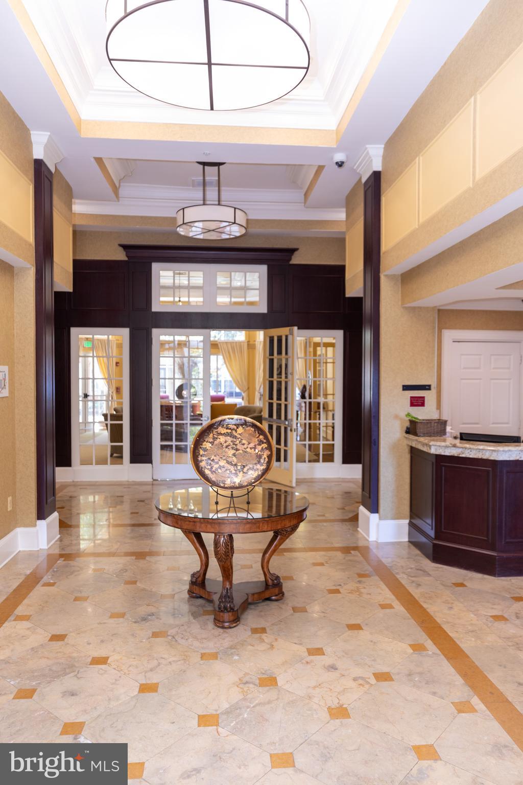 400 Symphony Circle, Unit 418H Cockeysville, MD 21030 - Photo 3 of 17 a living room filled with furniture