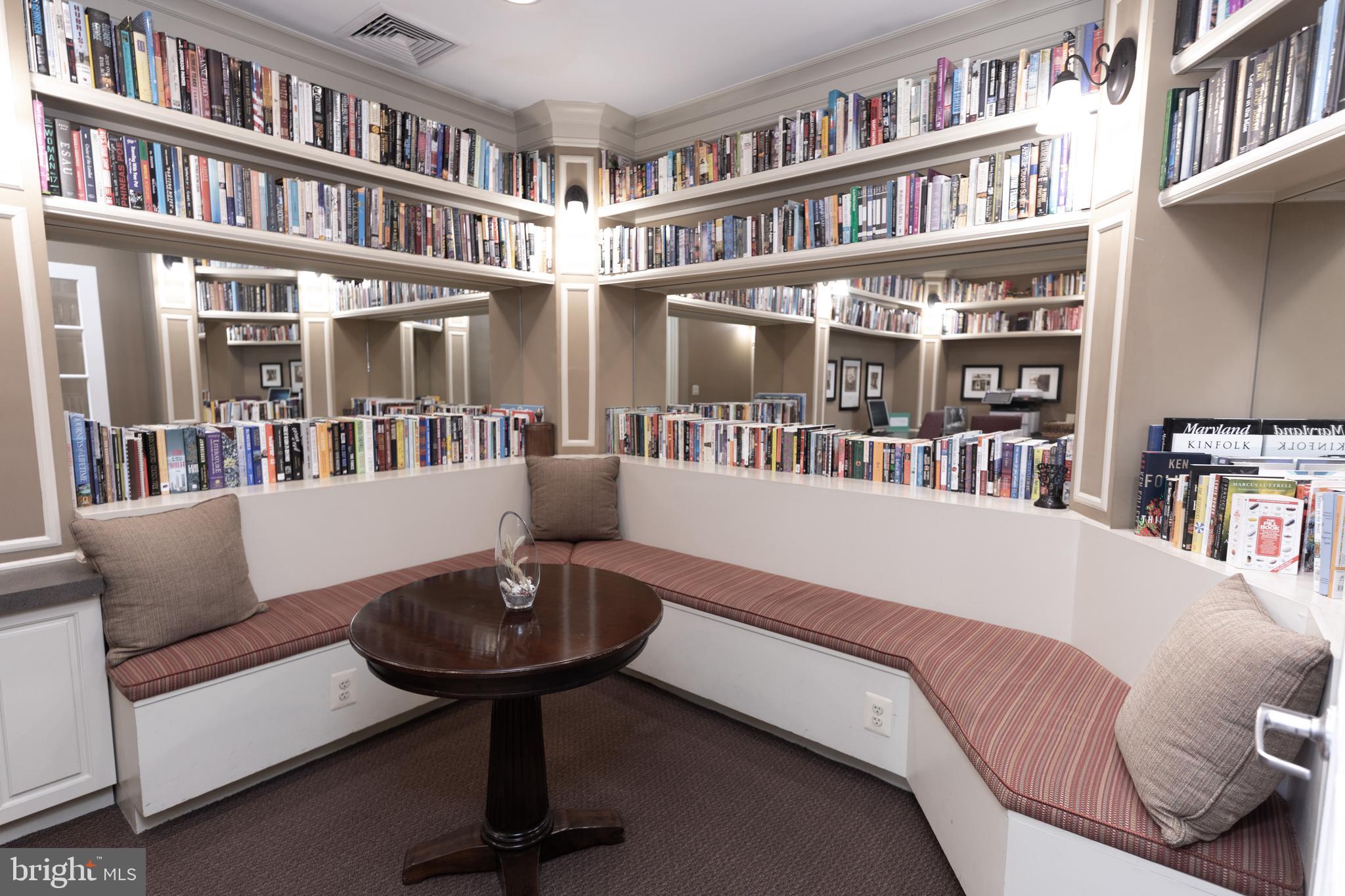 400 Symphony Circle, Unit 418H Cockeysville, MD 21030 - Photo 4 of 17 a living room with furniture and a book shelf