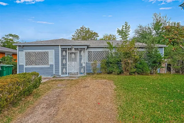 front view of a house with a garden