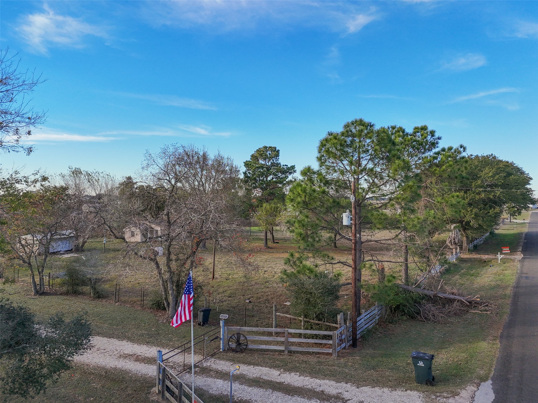 19703 Frey Road Pine Island, TX 77445 - Photo 6 of 18 a view of a pathway with a wrought fence