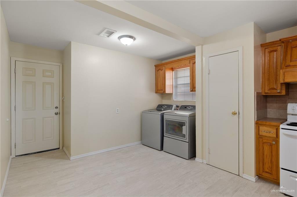 300 North 41st Street McAllen, TX 78501 - Photo 6 of 13 a view of a kitchen with a sink stove and a window