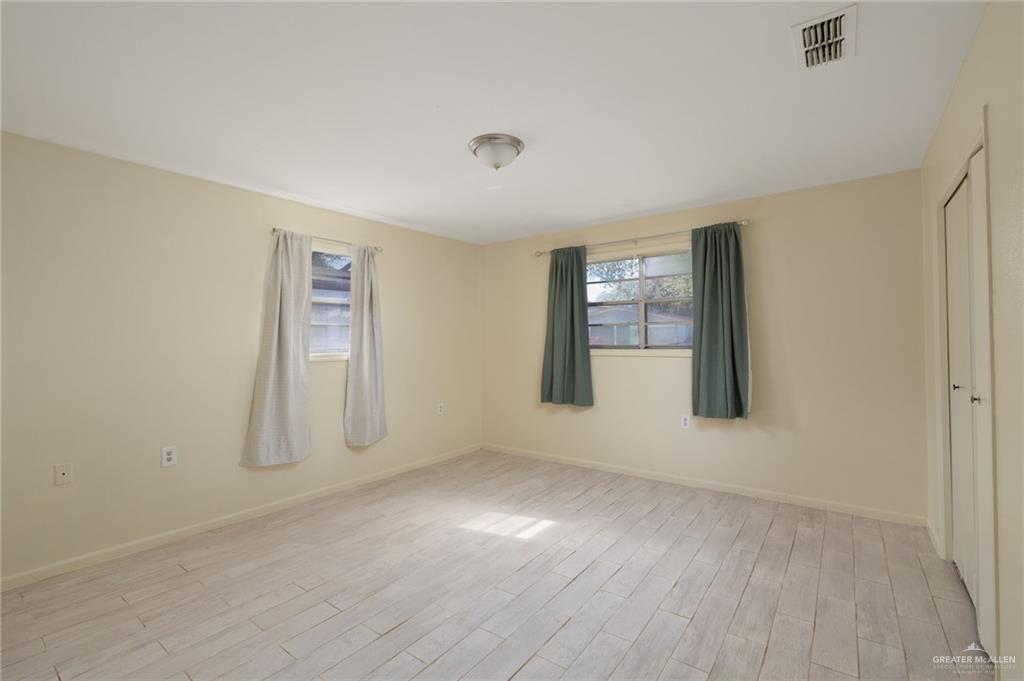 300 North 41st Street McAllen, TX 78501 - Photo 7 of 13 an empty room with windows and closet