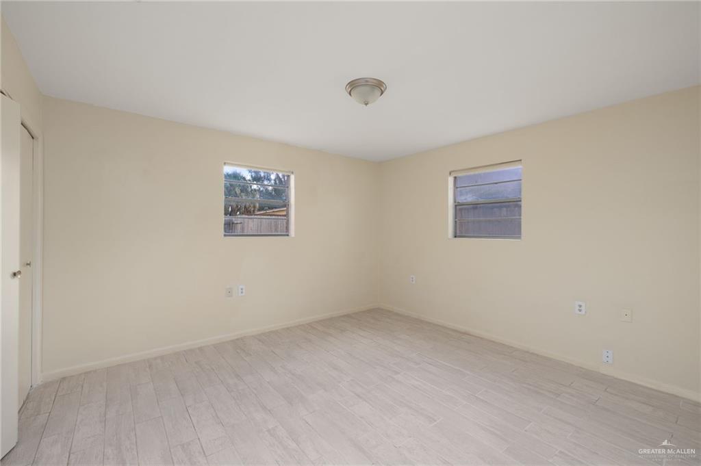 300 North 41st Street McAllen, TX 78501 - Photo 10 of 13 an empty room with a hallway