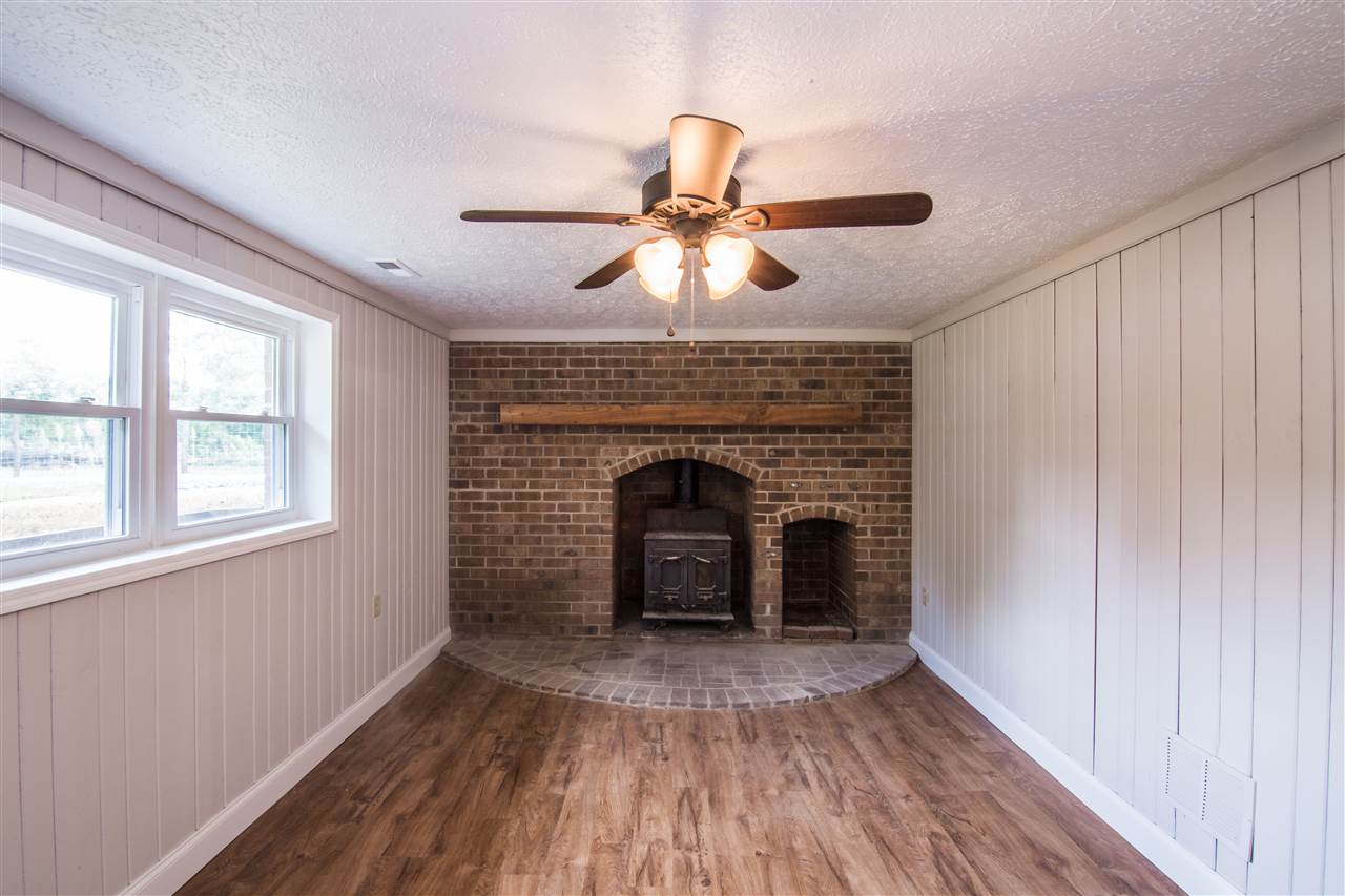 7495 Briery Branch Road Dayton, VA 22821 - Photo 12 of 19 a view of a livingroom with a fireplace and wooden floor