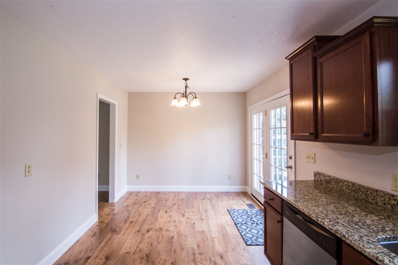 7495 Briery Branch Road Dayton, VA 22821 - Photo 8 of 19 a view of a kitchen island wooden floor and staircase