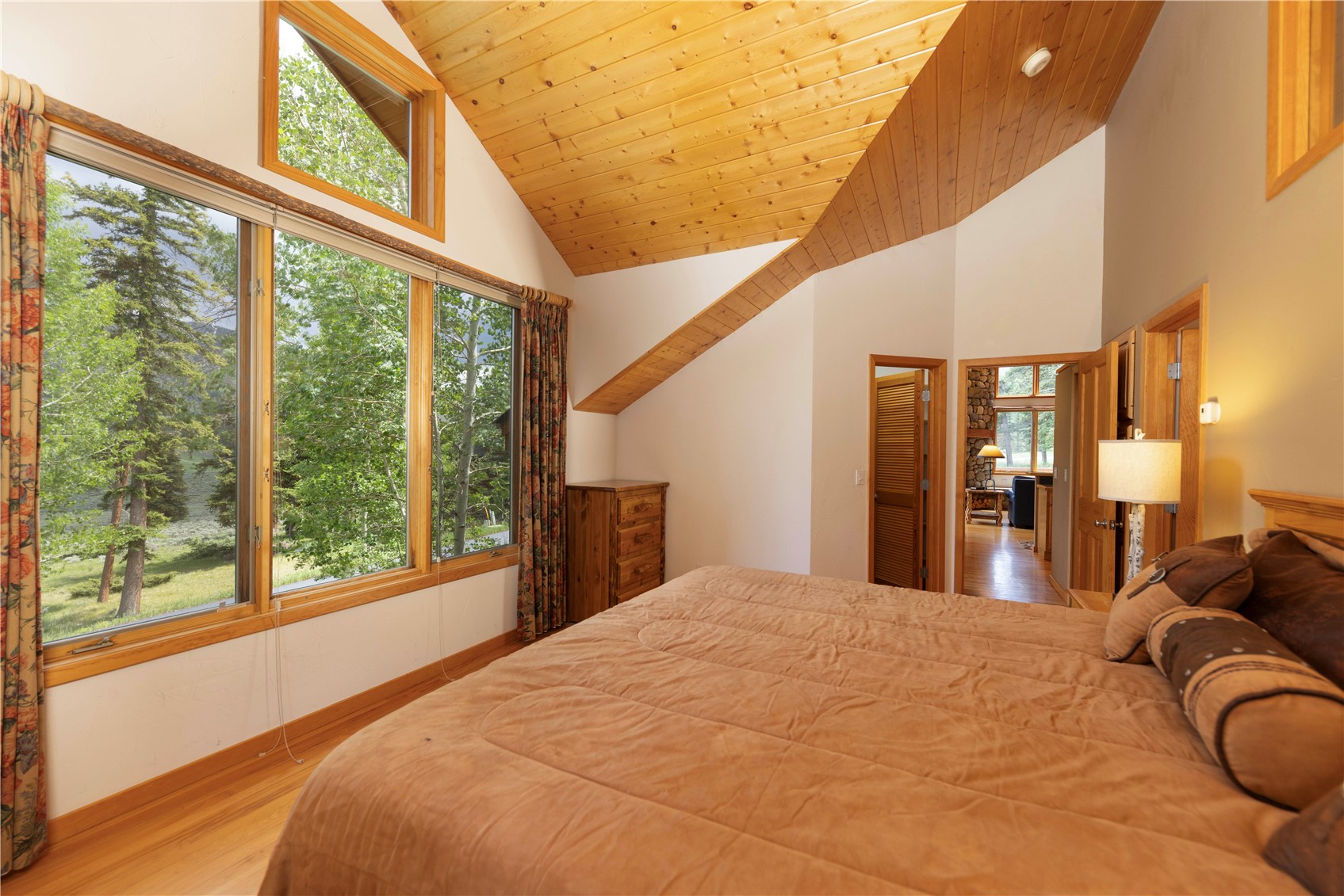 760 Penstemon Road Keystone, CO 80435 - Photo 18 of 39 Bedroom featuring wood-type flooring, high vaulted ceiling, and wooden ceiling