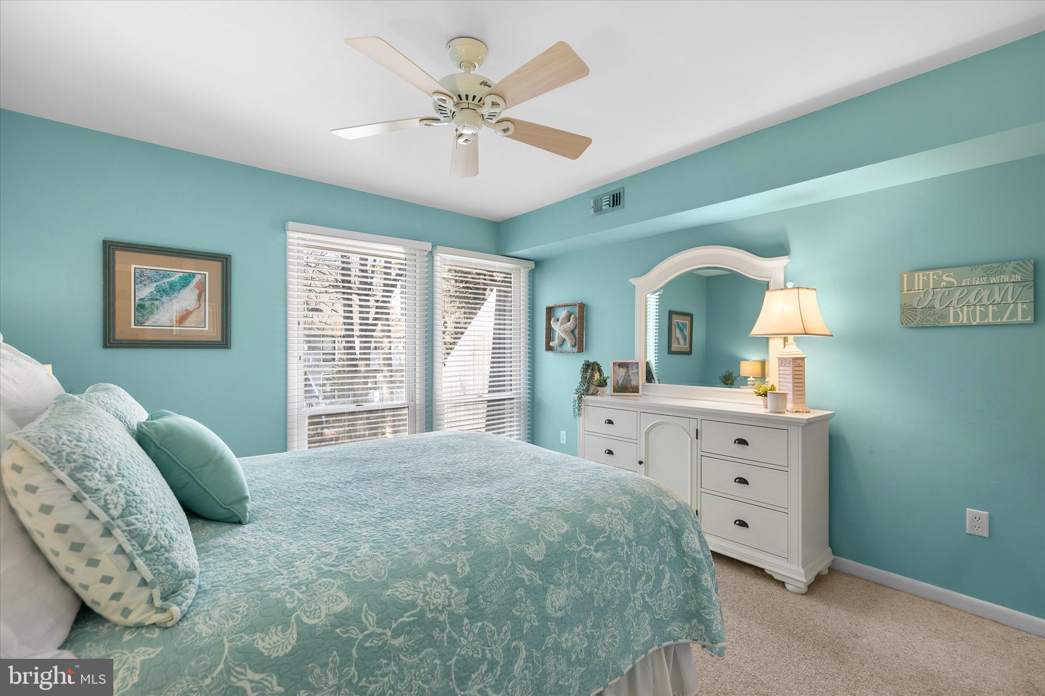 39362 Racquet Lane, Unit 8605 Bethany Beach, DE 19930 - Photo 14 of 53 a bedroom with a large bed and a dresser
