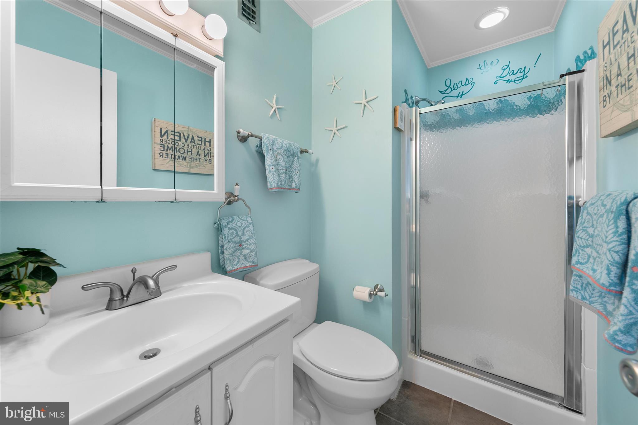 39362 Racquet Lane, Unit 8605 Bethany Beach, DE 19930 - Photo 15 of 53 a bathroom with a sink toilet and shower