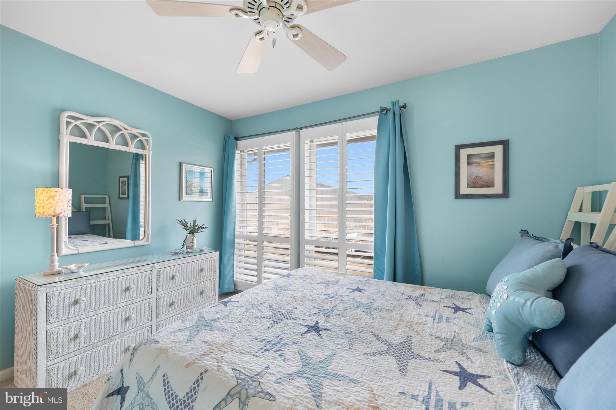 39362 Racquet Lane, Unit 8605 Bethany Beach, DE 19930 - Photo 17 of 53 a bedroom with a large bed and a window
