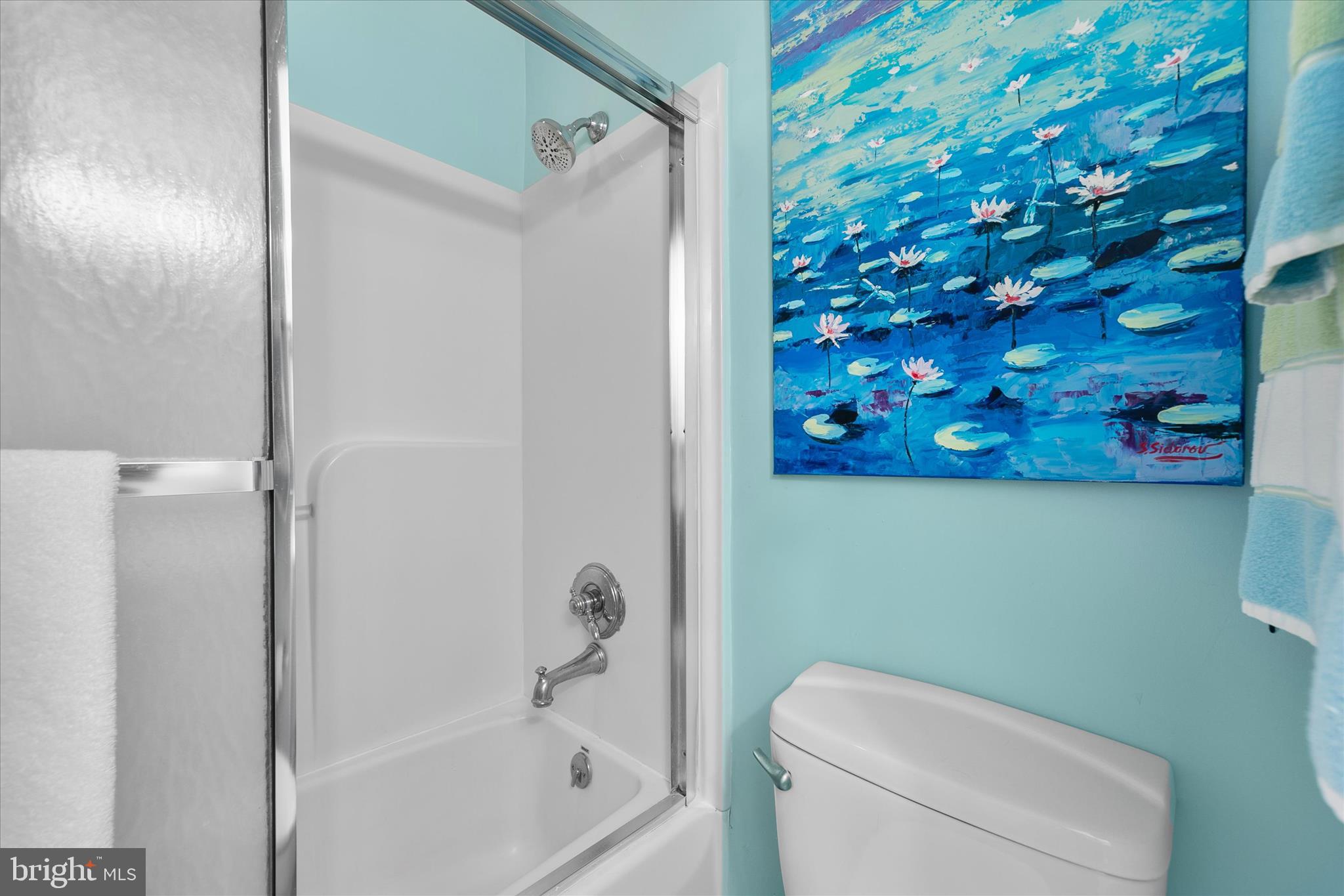 39362 Racquet Lane, Unit 8605 Bethany Beach, DE 19930 - Photo 19 of 53 a bathroom with a toilet and a shower