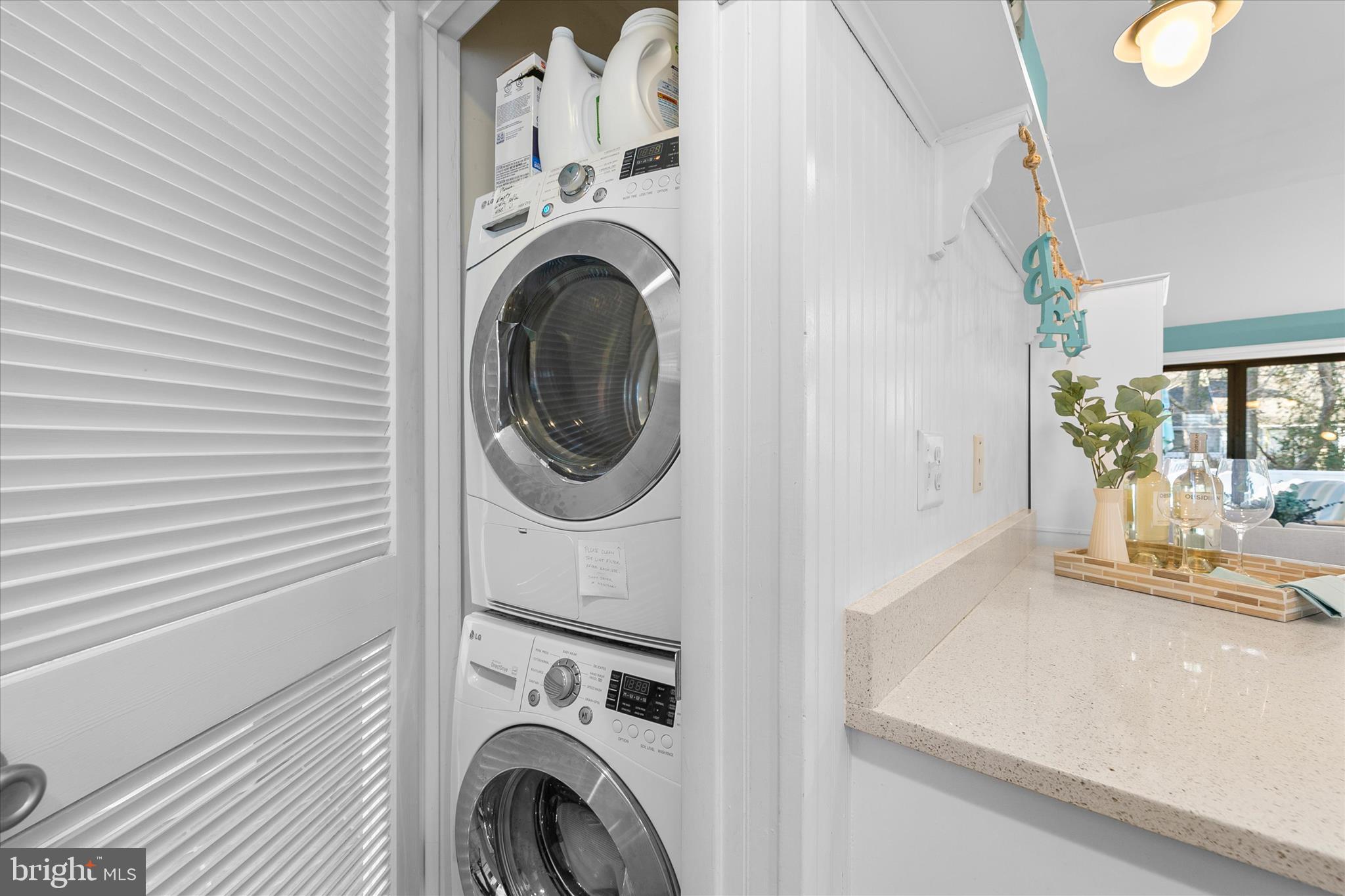 39362 Racquet Lane, Unit 8605 Bethany Beach, DE 19930 - Photo 20 of 53 a view of a storage and utility room with washer and dryer